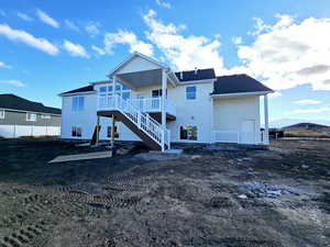 Rear view of property with a mountain view