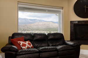 Living room with a mountain view and a high end fireplace