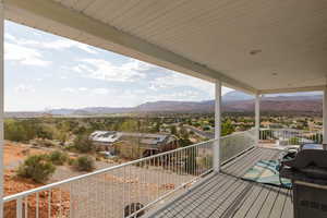 Wooden terrace featuring a mountain view