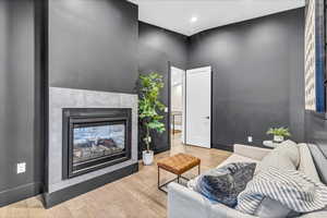 Living room with light hardwood / wood-style flooring