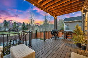 Deck at dusk with area for grilling