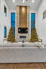 Unfurnished living room featuring a fireplace and hardwood / wood-style floors