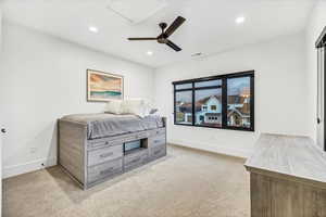 Bedroom with light colored carpet and ceiling fan