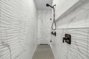 Bathroom with a tile shower