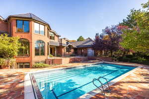 View of pool featuring a patio area