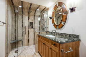 Bathroom with vanity and an enclosed shower