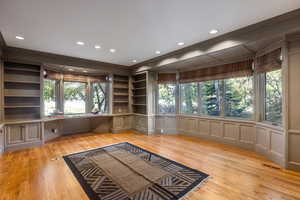 Interior space with a healthy amount of sunlight, light wood-type flooring, and crown molding