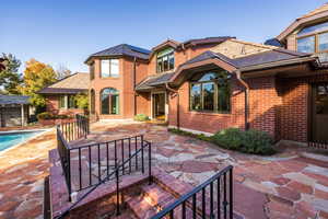 Rear view of property with a patio