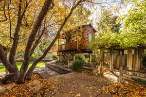 View of yard featuring a patio area and a wooden deck