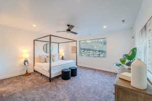 Carpeted bedroom with ceiling fan