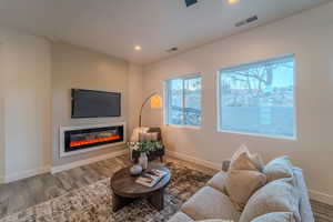 Living room with hardwood / wood-style floors