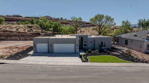 View of front facade featuring a garage