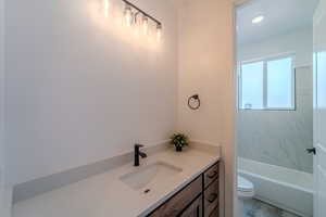 Bathroom with toilet and vanity