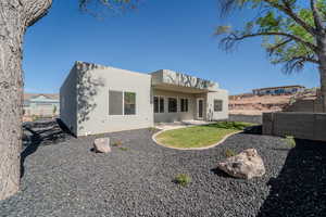 Rear view of property featuring a patio