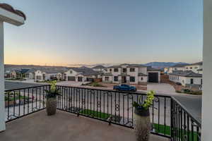 Balcony at dusk with a mountain view