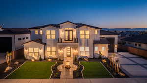 Mediterranean / spanish-style house featuring a yard and a balcony