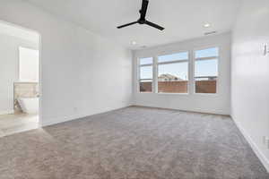 Unfurnished room with ceiling fan, light carpet, and recessed lighting