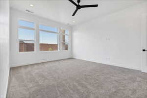 Spare room featuring a ceiling fan, carpet floors, and recessed lighting