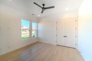 Unfurnished room featuring ceiling fan and light hardwood / wood-style flooring