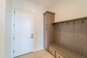 Mudroom with light wood-type flooring