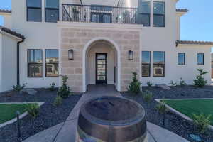 Doorway to property with a balcony