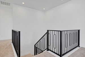 Staircase featuring recessed lighting and carpet