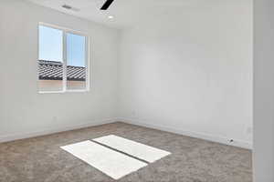 Carpeted spare room featuring a ceiling fan and recessed lighting