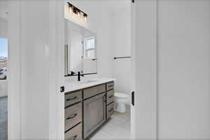 Bathroom with healthy amount of natural light and vanity