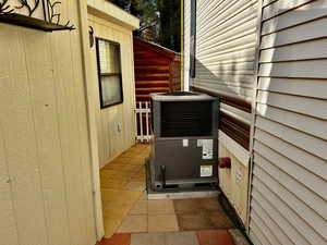 Exterior details with wooden walls and central air condition unit