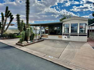 View of front facade featuring a carport