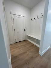 Mudroom with light hardwood / wood-style flooring