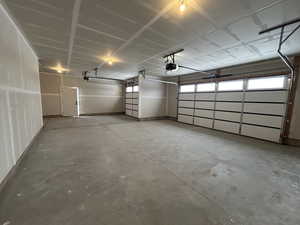 Garage featuring a garage door opener