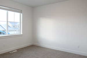 Spare room with carpet floors