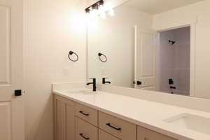 Bathroom featuring bathing tub / shower combination and vanity