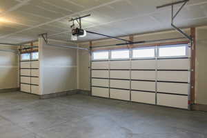 Garage featuring a garage door opener