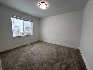 View of carpeted spare room