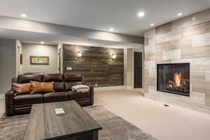 Living room featuring a tile fireplace and light colored carpet