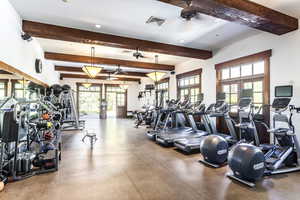 Workout area with plenty of natural light and ceiling fan