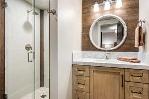 Bathroom featuring vanity and walk in shower