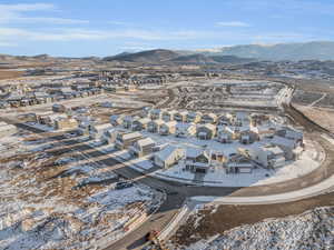 Snowy aerial view featuring a mountain view