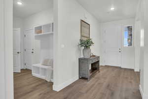 Entrance foyer featuring light hardwood / wood-style floors