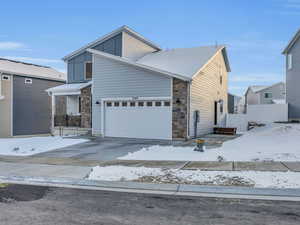 View of front of home featuring a garage