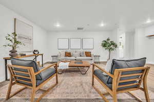 Living room featuring light hardwood / wood-style flooring