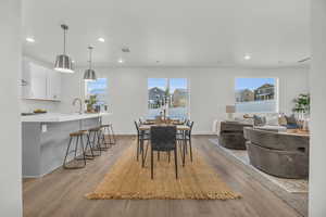 Dining area featuring light hardwood / wood-style floors and sink