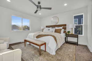 Bedroom featuring ceiling fan and carpet floors