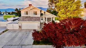 View of front facade featuring a mountain view and a garage