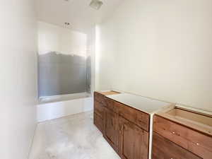 Bathroom with concrete flooring