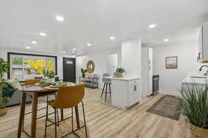 Dining area featuring light hardwood / wood-style flooring and sink