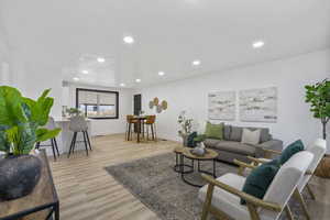 Living room with light wood-type flooring