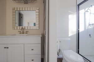 Bathroom with toilet and vanity